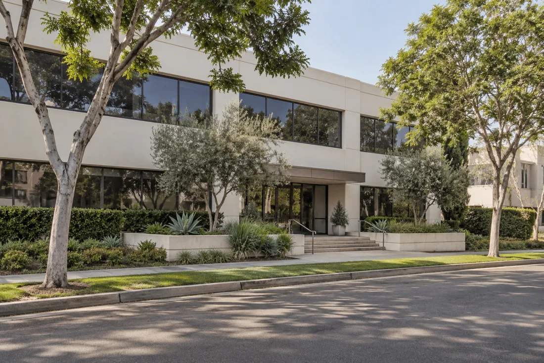 Representative neighborhood scene: A low-rise professional office building with a landscaped entrance
