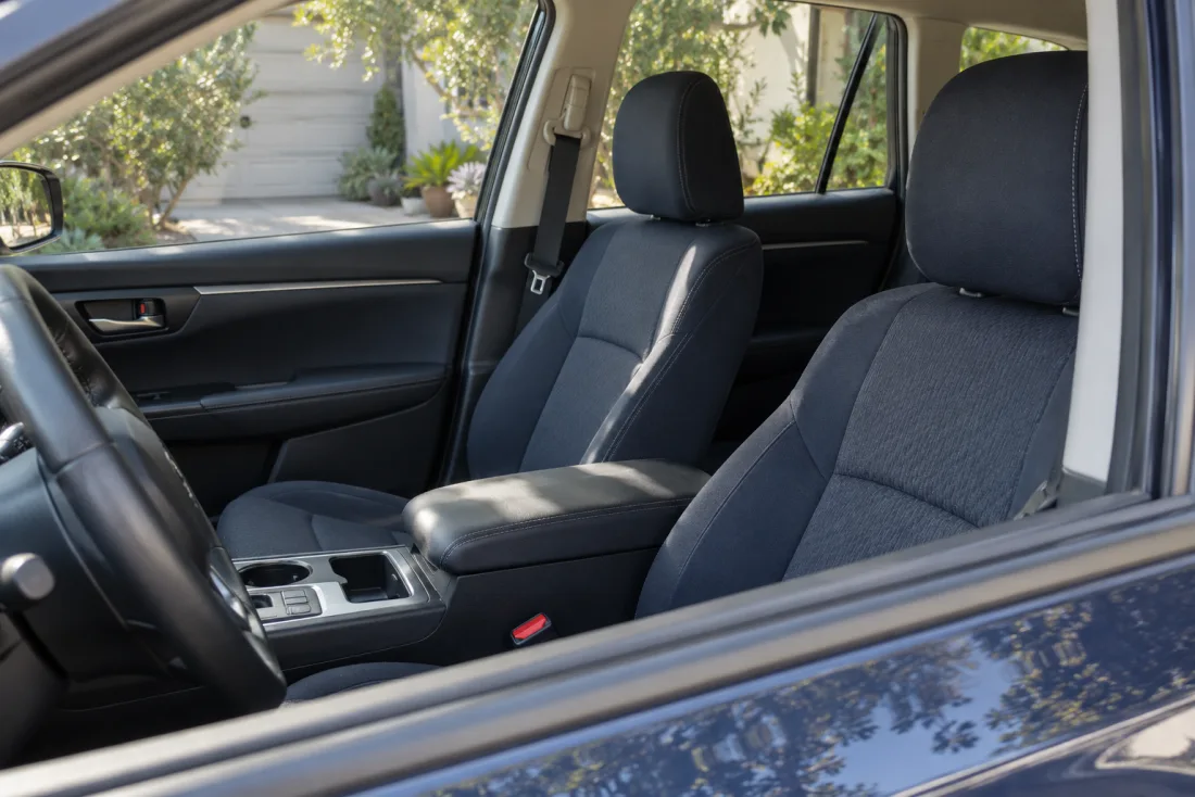 The empty interior and seat belt of a parked car